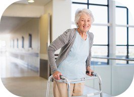 Older woman walking with a walker